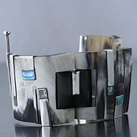 Sterling silver charm bracelet with mother-of-pearl and horn